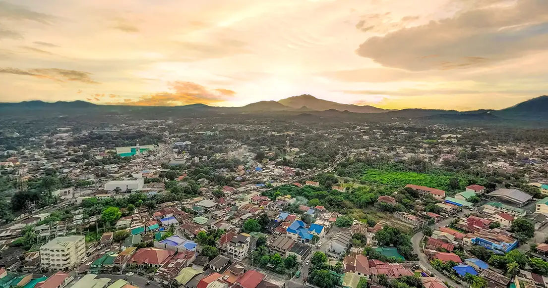 An aerial bird's-eye view of San Pablo, Laguna, showing the lush greenery and residential landscape surrounding the Bloomdale Residences community.