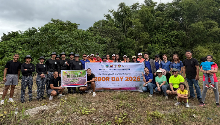Participants from Pinnacle Homes, CENRO San Jose del Monte, and partner organizations during the Arbor Day tree-planting activity at Regent Heights, SJDM.