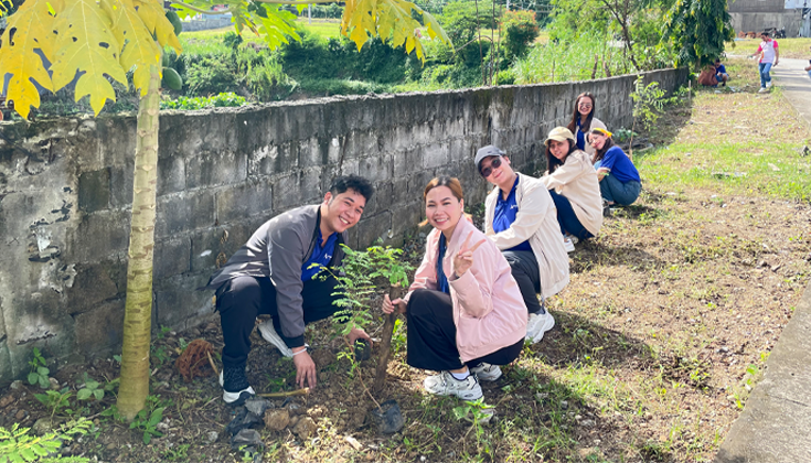Pinnacle Homes employees planting seedlings during the Arbor Day tree-planting activity at Regent Heights, San Jose del Monte, Bulacan.